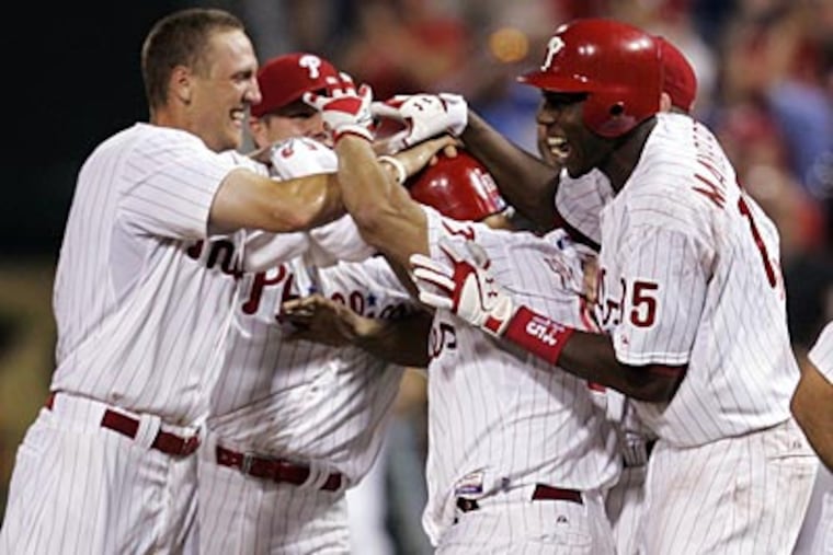 The Phillies scored the game-winning run against the Rockies on Wednesday after an error at first base. (Tom Mihalek/AP)