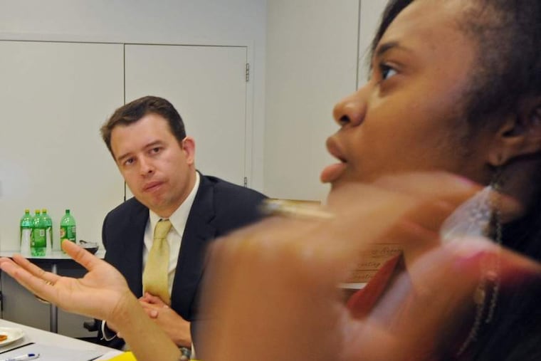 Superintendent candidate Pedro Martinez listens to Sharifa Garvey, 18, during a luncheon with students Monday.
APRIL SAUL / STAFF PHOTOGRAPHER