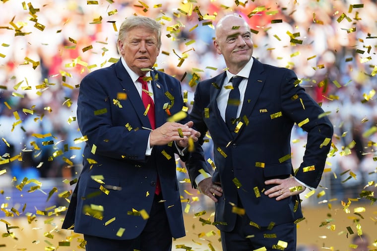 FIFA President Gianni Infantino (right) with U.S. president Donald Trump amid the confetti after the trophy presentation at the World Cup final.