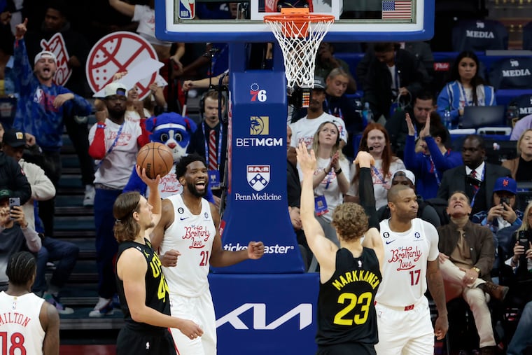 Sixers Joel Embiid smiles at Utah’s Lauri Markkanen after a missed free throw late in the fourth quarter back in November.