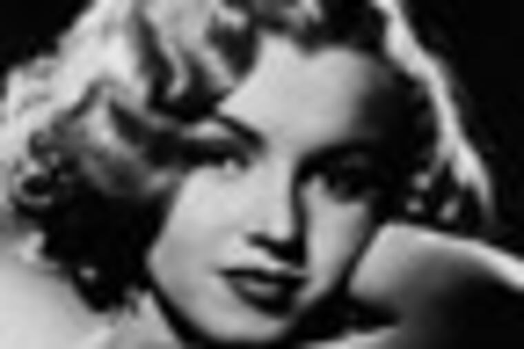 FILE - This undated photo shows actress Marilyn Monroe. In late 2012, the FBI has released a new version of files it kept on Monroe that reveal the names of some of her acquaintances who had drawn concern from government officials and members of her entourage over their suspected ties to communism. (AP Photo, File)
