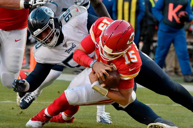 Titans defensive tackle DaQuan Jones (back) misses as Chiefs quarterback Patrick Mahomes scores in January. Jones is on the Titans' COVID-19/reserve list.