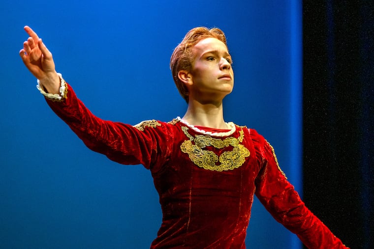 Carson Willey, 17, with the Rock School for Dance Education takes a bow after performing a dance from "Swan Lake."