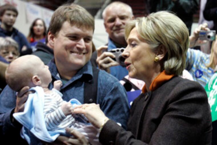 Sen. Hillary Clinton visiting with supporters Friday in Tacoma, Wash. An unofficial AP count gives her the lead in delegates, 1,045 to 960, with 2,025 needed for victory.