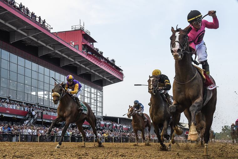Tyler Gaffalione rides War of Will, right, to a first-place finish during the 144th running of the Preakness Stakes at Pimlico Race Course on Saturday.