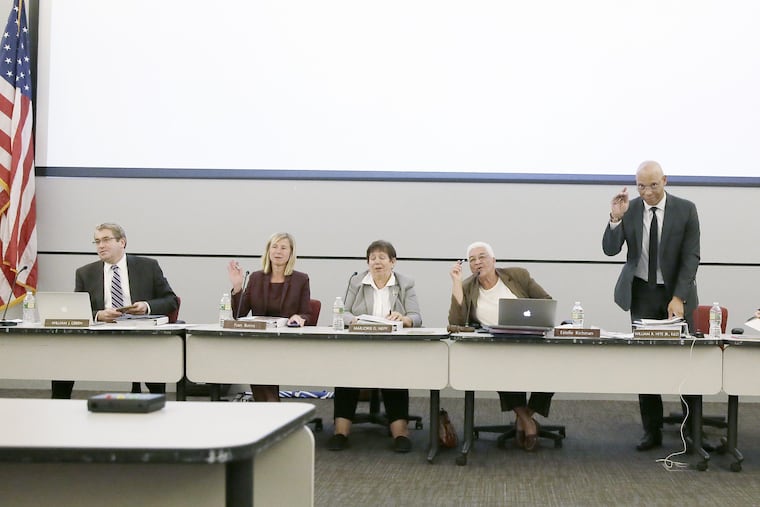 SRC members and superintendent William Hite wave as they thank a staffer at the final School Reform Commission meeting. From left to right: Bill Green, Fran Burns, Marge Neff, Estelle Richman and Hite.