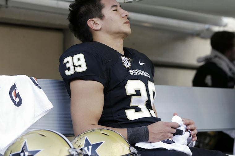 Carey Spear is a kicker who is not afraid of contact.