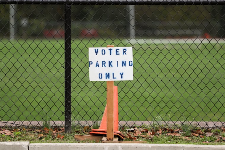 Signage designates 'Voter Parking Only' on Election Day at Radnor High School in 2021.
