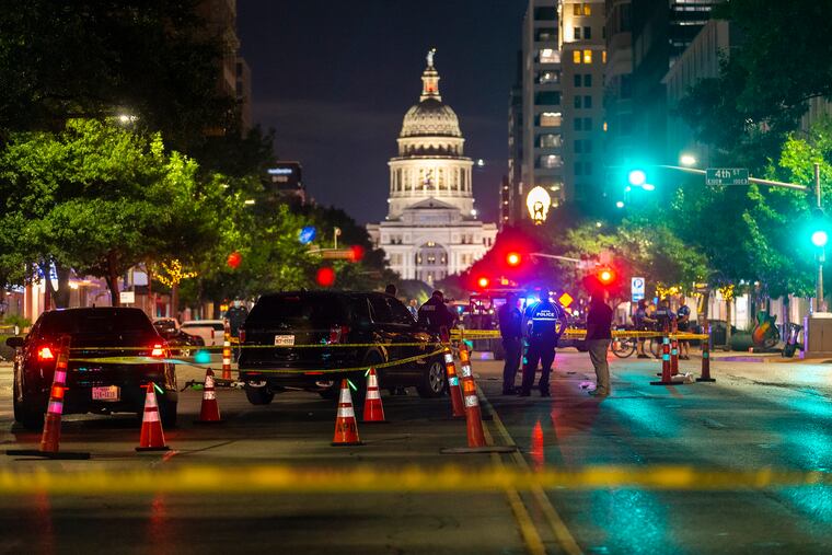 Police investigate a homicide shooting that occurred at a demonstration against police violence in downtown Austin, Texas, July 25, 2020.