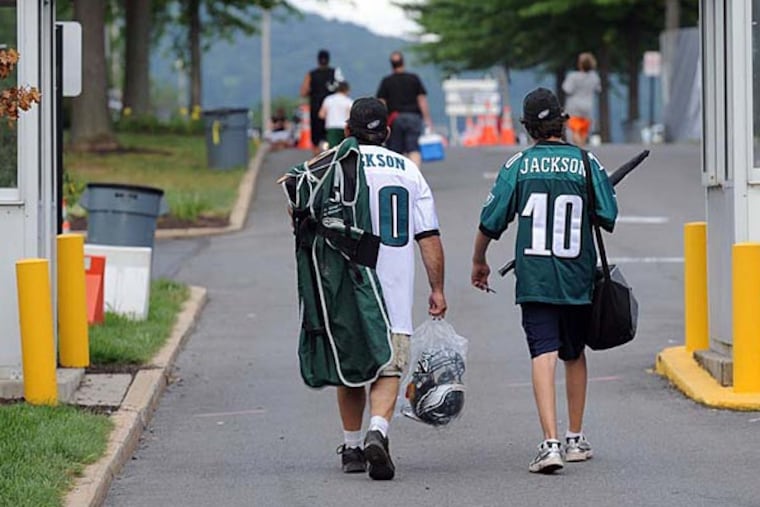 Eagles fans leave the complex after practice with memorabilia in hand during training camp at Lehigh University. (Tom Kelly IV / Staff Photographer)