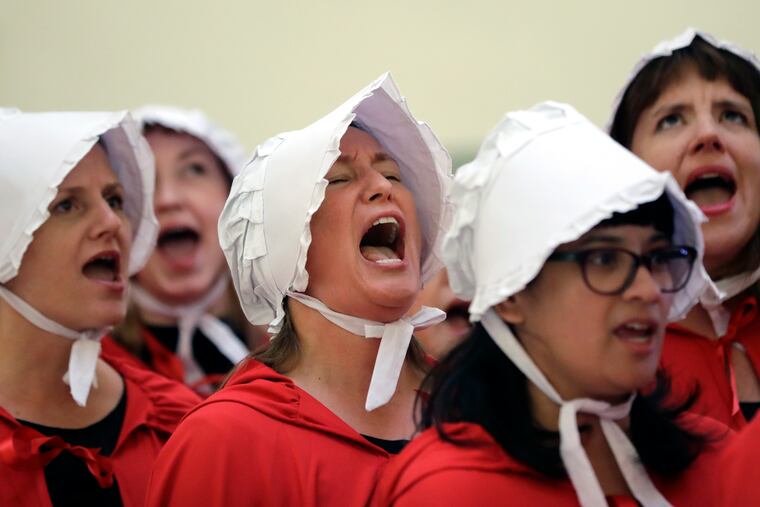 FILE - In this Tuesday, May 23, 2017 file photo, activists dressed as characters from "The Handmaid's Tale" chant in the Texas Capitol Rotunda as they protest SB8, a bill that would require health care facilities, including hospitals and abortion clinics, to bury or cremate any fetal remains whether from abortion, miscarriage or stillbirth, and they would be banned from donating aborted fetal tissue to medical researchers in Austin. Tissue left over from elective abortions has been used in scientific research for decades, and is credited with leading to lifesaving vaccines and other advances. (AP Photo/Eric Gay)
