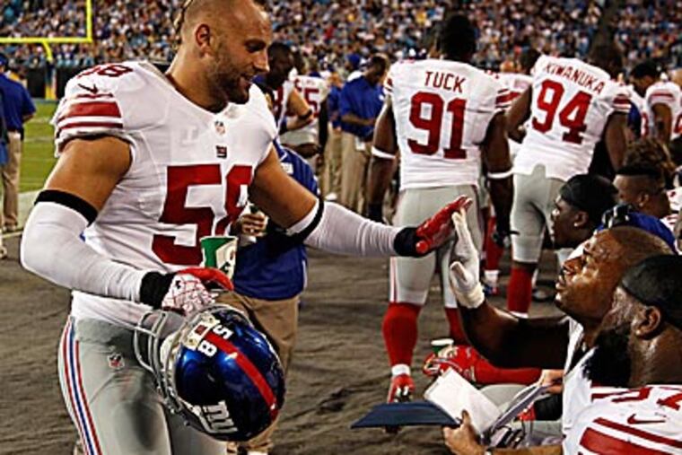 New York Giants linebacker Mark Herzlich was an Eagles fan while attending Conestoga High School. (Bob Leverone/AP)