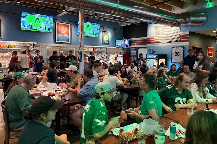 Chase Utley and Vince Papale jerseys are among the Philly sports memorabilia hanging on the walls in Brotherly Love Cheesesteaks in Nashville, Tenn.