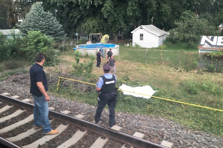 SEPTA Transit police officers near the body of a 42 year old male that was struck and killed by train along the northeast corridor near the Bridesburg Station of the Trenton Line on Wednesday morning September 13, 2017.