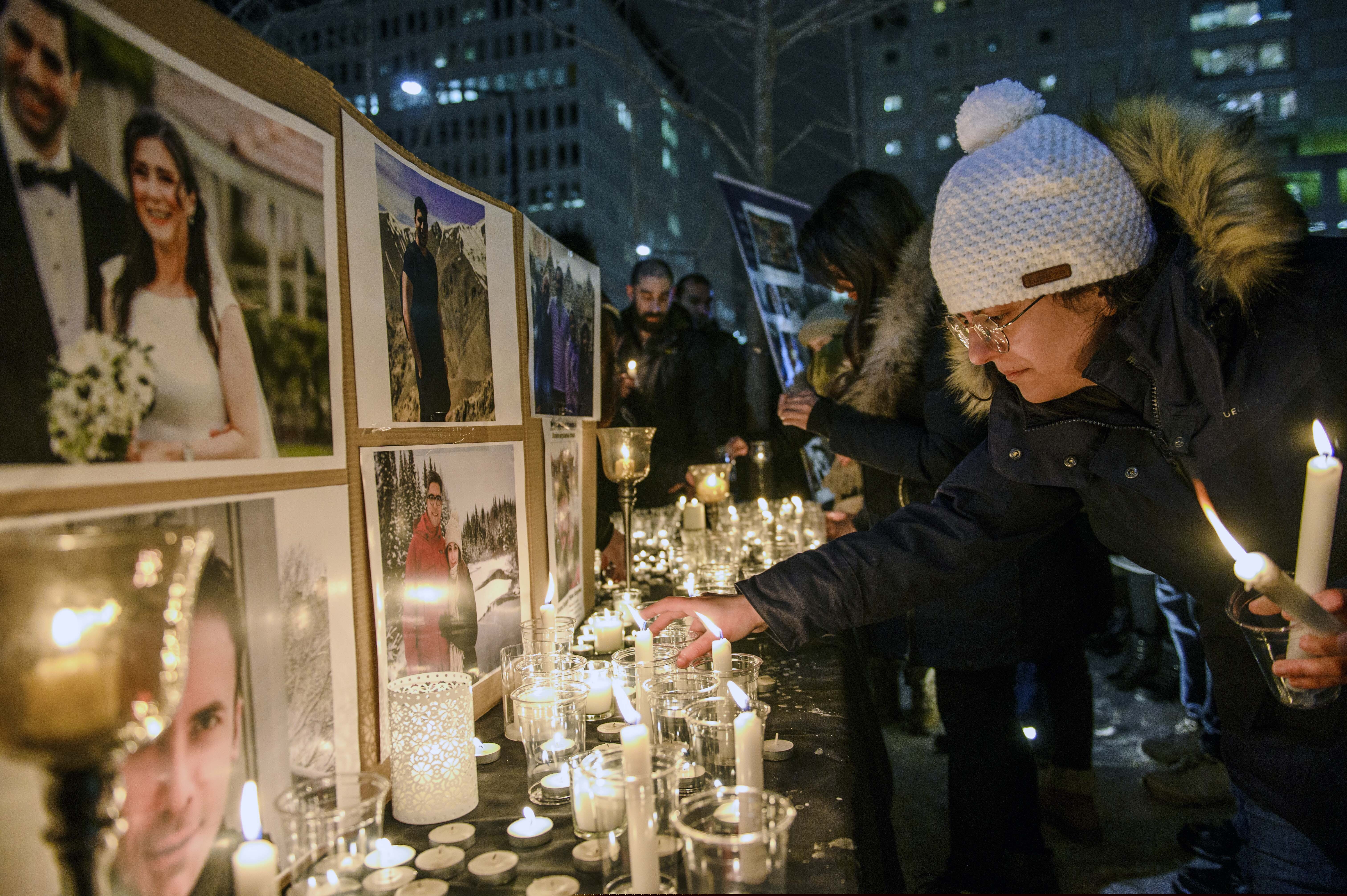 Members of Montreal's Iranian community attend a vigil, Thursday, Jan. 9, 2019 in downtown Montreal. It is “highly likely” that Iran shot down the civilian Ukrainian jetliner that crashed near Tehran late Tuesday, killing all 176 people on board, U.S., Canadian and British officials declared Thursday. They said the fiery missile strike could well have been a mistake amid rocket launches and high tension throughout the region.