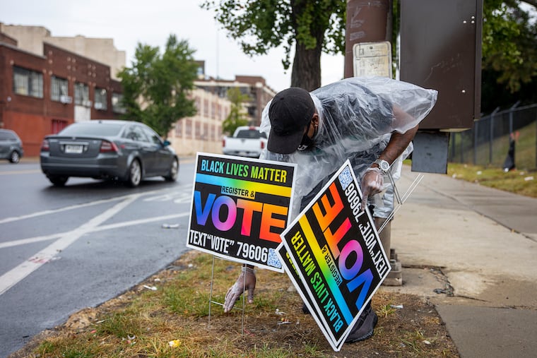 Damien Grobes, 42, of West Philadelphia, during a voter registration drive Saturday in North Philadelphia.