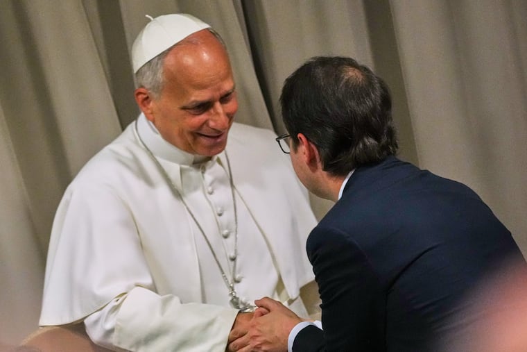 Pope Leo XIV, left, greets Anthropic co-founder Christopher Olah during the presentation of the Pope's first encyclical, "Magnifica humanitas: On Safeguarding the Human Person in the Time of Artificial Intelligence," at the Vatican, Monday, May 25, 2026.