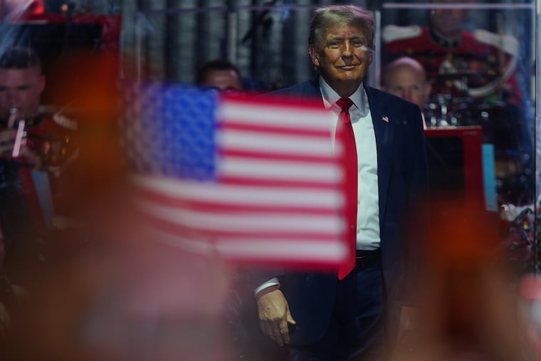 President Donald Trump stands on stage after speaking at the opening of the Great American State Fair on the National Mall, Wednesday, June 24, 2026, in Washington.