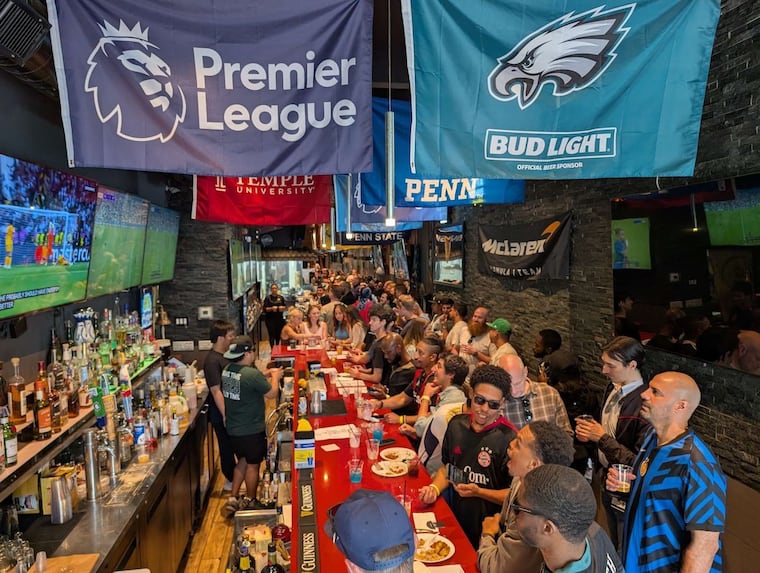 Inside Lion Sports Bar, while soccer matches are played across the bar's 35 screens in Chinatown, Philadelphia.