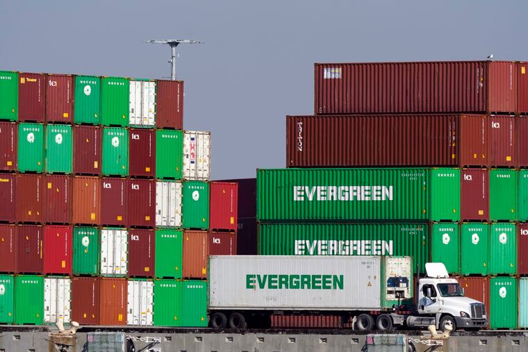 FILE - Shipping containers are stacked over a truck at the Port of Los Angeles Wednesday, Nov. 10, 2021, in Los Angeles. (AP Photo/Marcio Jose Sanchez, File)