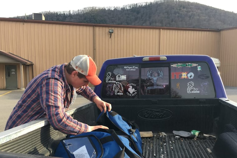Ryan Clark, 18, of Emporium, Cameron County, delivers pizzas in his truck on April 21, 2018