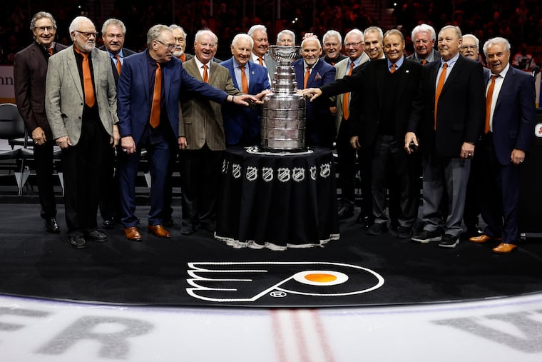 Members of the 1973-74 Flyers Stanley Cup team were in the house with the Cup before Friday night's alumni game.