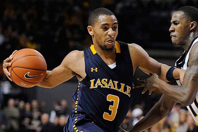 La Salle's Tyeek Duren drives against Virginia Commonwealth's Rob
Brandenberg during the second half of an NCAA college basketball
game Saturday, Jan. 26, 2013, in Richmond, Va. (Clement Britt/AP)