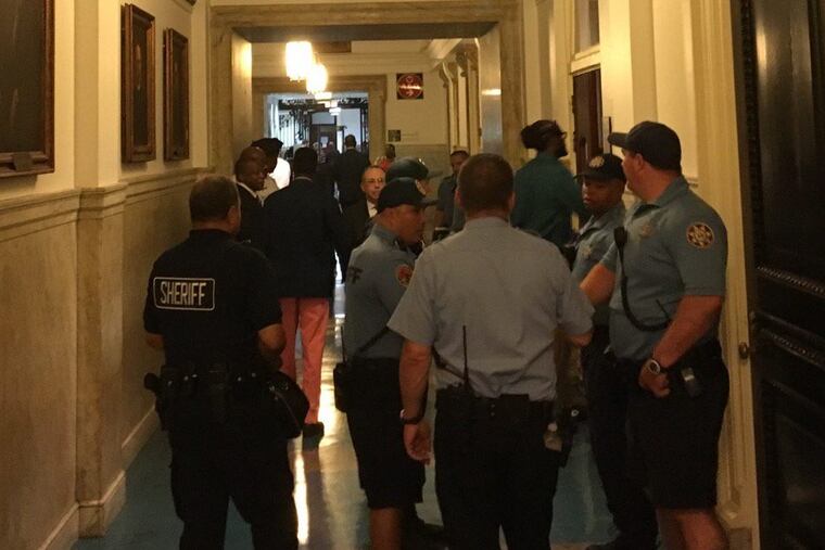 Black Lives Matter activists and sheriff’s deputies gather before the Council session began.
