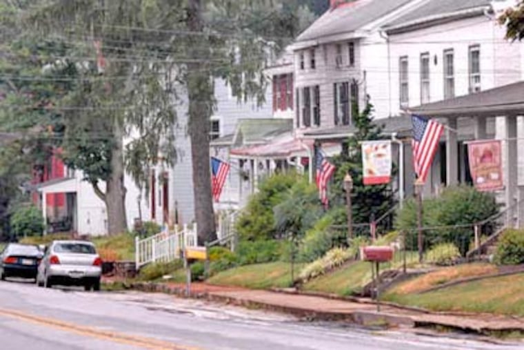 Warren Scott, who owns the Marshalton Inn, above, and the Four Dogs Tavern, said he didn't want to hear about deadlines for the project, but wanted to get the work done right. (April Saul / Staff Photographer)