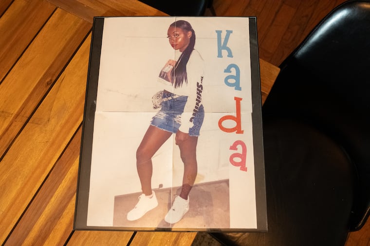 Kevin Scott, Kada Scott’s father, with a photo of his daughter.