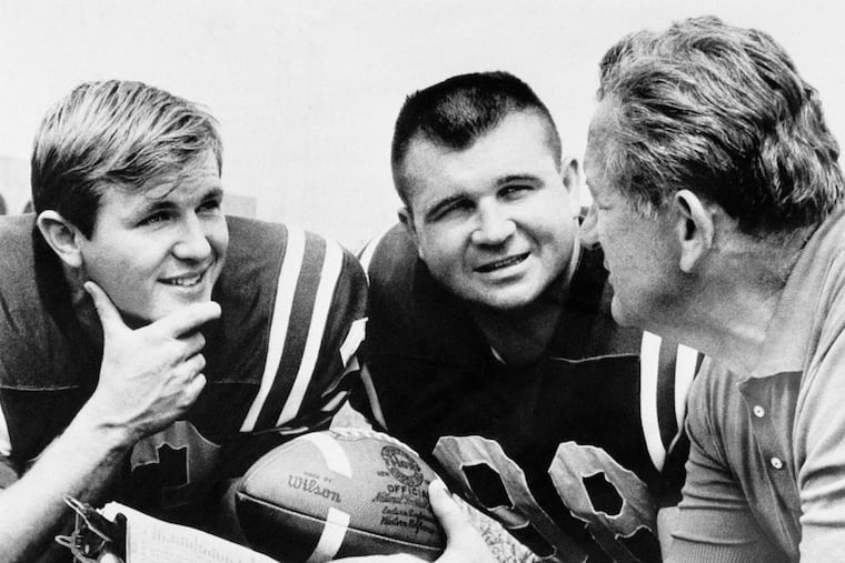 Joe Kuharich (right) coached the Eagles from 1964-1968, leading an abysmal team through a nearly forgotten pandemic in his last season at the helm.