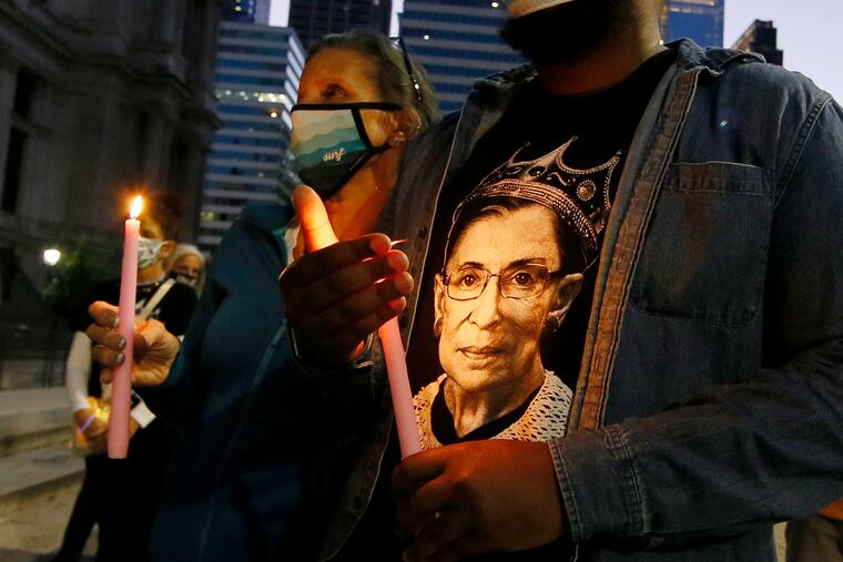 People gather on the north side of Phila City Hall for a vigil honoring Supreme Court Justice Ruth Bader Ginsburg on Sept. 19, 2020.