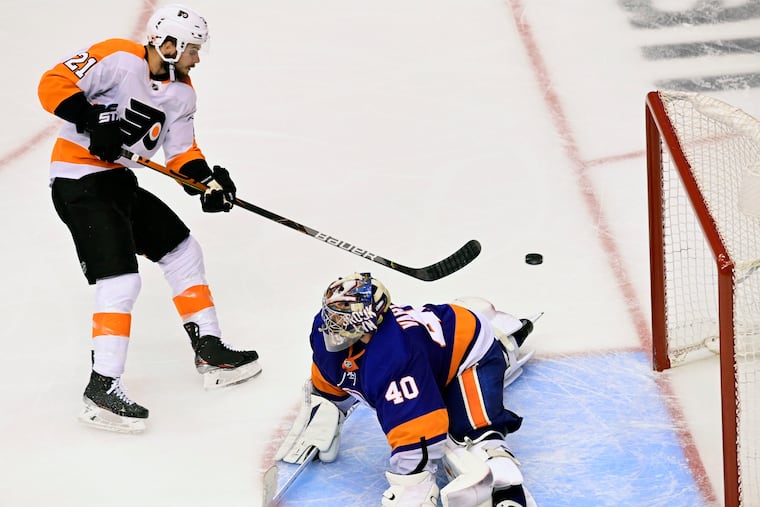 Flyers center Scott Laughton scoring on New York Islanders goaltender Semyon Varlamov in the third period to tie Game 6 of the conference semifinals. The Flyers won in double overtime.