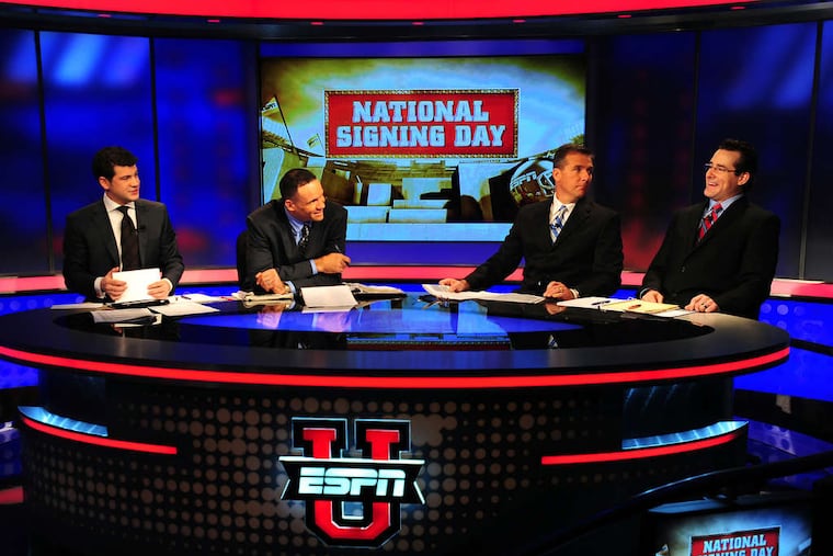 The Comcast-Disney contract expands the reach of the ESPN sports network. This football panel comprised (from left) Lowell Galindo, Robert Smith, Urban Meyer, and Tom Luginbill.