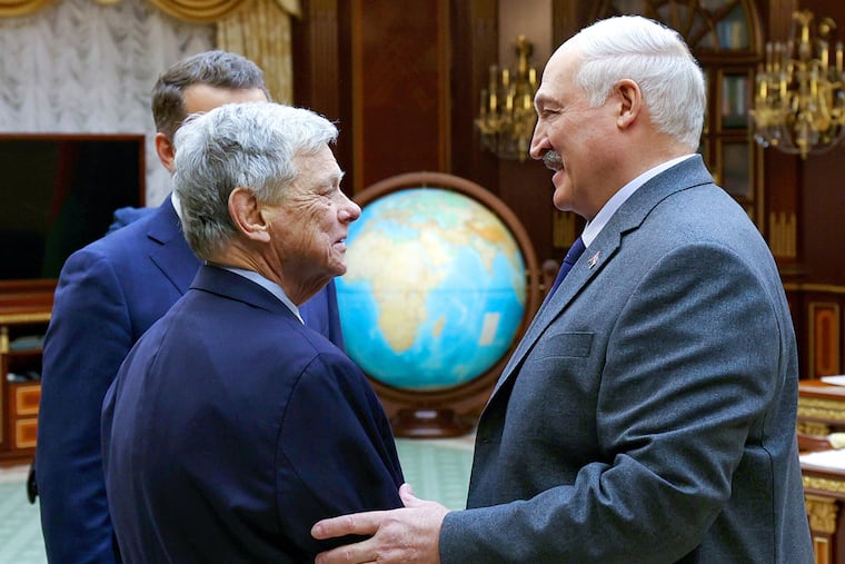 In this photo released by Belarusian presidential press service, Belarusian President Alexander Lukashenko (right) and U.S. presidential envoy John Coale shake hands during their meeting Friday in Minsk.