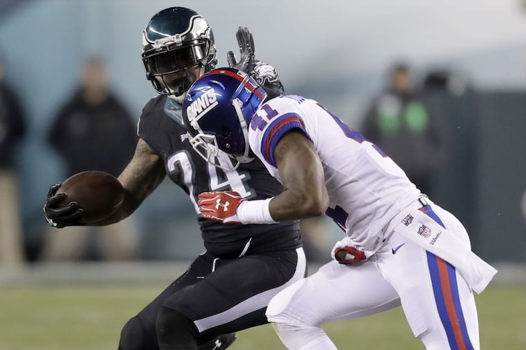 Eagles' running back Ryan Mathews #24 runs with the football against New York Giants' cornerback Dominique Rodgers-Cromartie #41 on Thursday, December 22, 2016 in Philadelphia.
