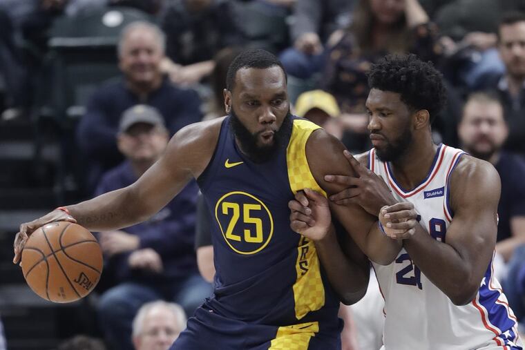 Sixers’ center Joel Embiid is defending Pacers’ big man Al Jefferson during the Sixers’ loss to the Pacers on Saturday.