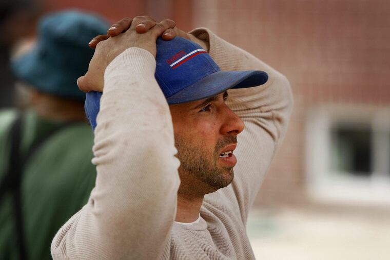 A construction worker watches after another worker fell from scaffolding at a work site in the city’s Fairmount section Monday afternoon and was pronounced dead about 1:45, police said.Authorities said the unidentified 30-year-old man came in contact with a live wire while working on the third floor of a building under construction at 20th and Parrish Streets and fell to the ground.A police spokeswoman said the cause of death was under investigation. ALEJANDRO A. ALVAREZ / Staff Photographer