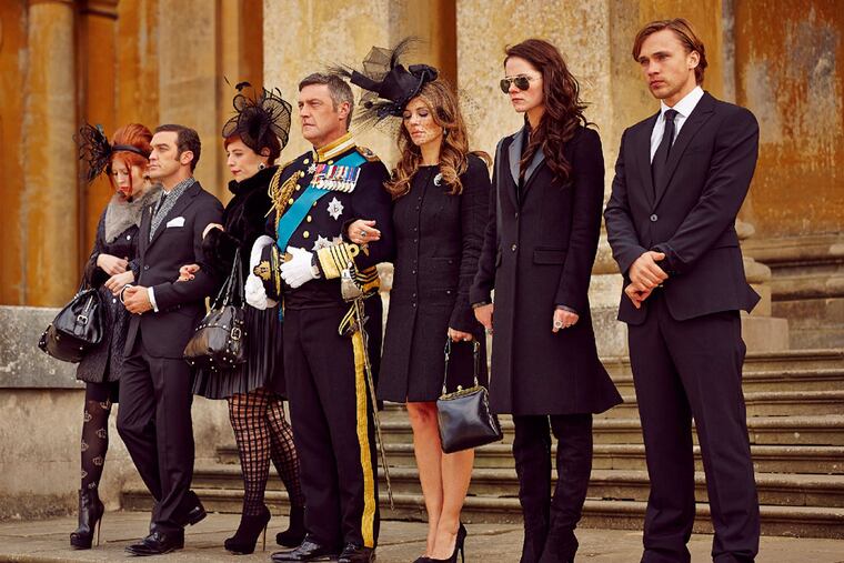 Not quite themselves, really: "The Royals" features (from left) Hatty Preston, Jake Maskall, Lydia Rose Bewley, Vincent Regan, Elizabeth Hurley, Alexandra Park, and William Moseley as a fictional ruling family. (Paul Blundell / E! Entertainment)