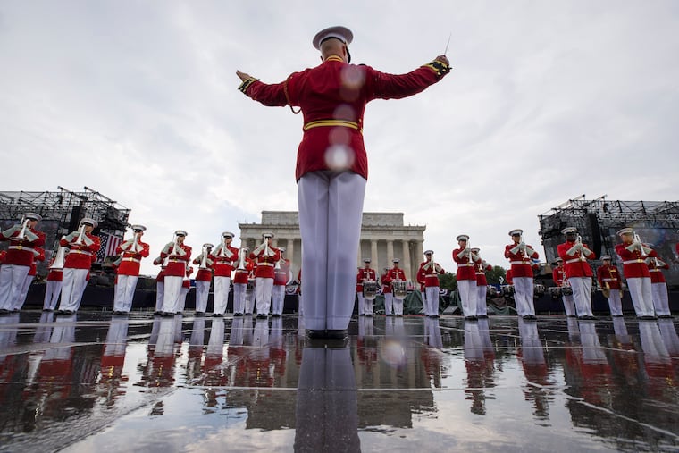 File photo of the U.S. Marine Corps Drum and Bugle Corps performing in the rain during an Independence Day celebration in front of the Lincoln Memorial in Washington on July 4, 2019.