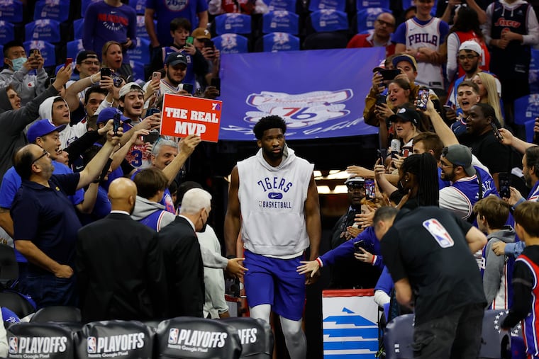 The Sixers' Joel Embiid is greeted by fans before his team's Game 6 meeting with the Heat in the the Eastern Conference semifinals.