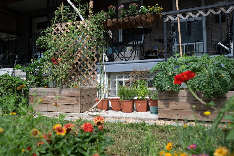 Emmett Cawley, who loves DIY projects, built garden beds out front.
