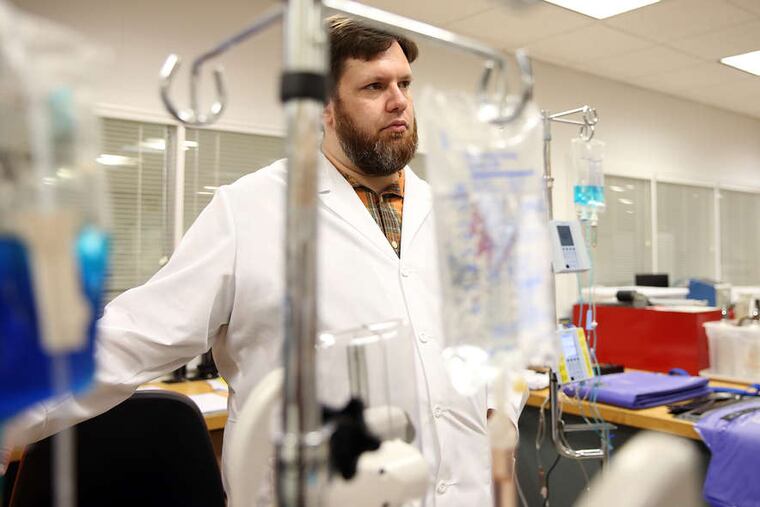 Brad Bonnette, an ECRI project officer with the health devices engineering group, at work in the firm's Plymouth Meeting lab.