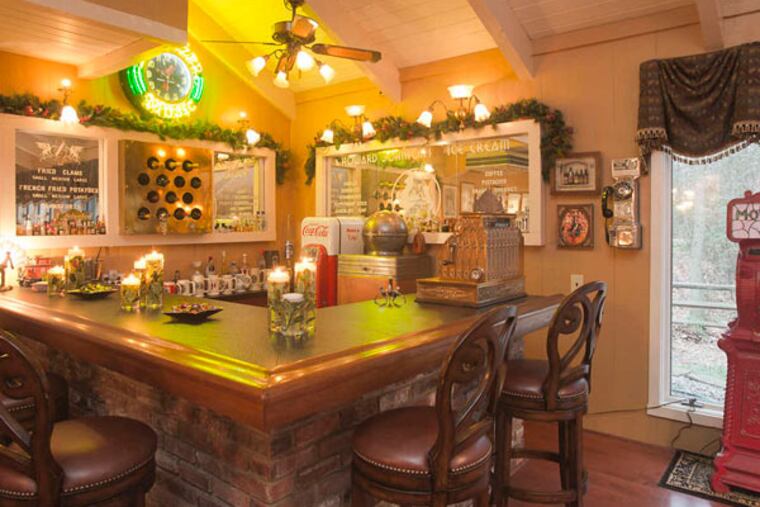 The great room has a bar, old juke boxes, and other offbeat antiques, some of which George Sideris has rewired and reconditioned.