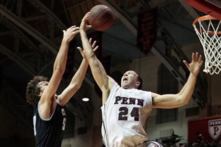 Penn's Jack Eggleston grabs a rebound away from Yale's Jeremiah Kreisberg. (Elizabeth Robertson/Staff Photographer)