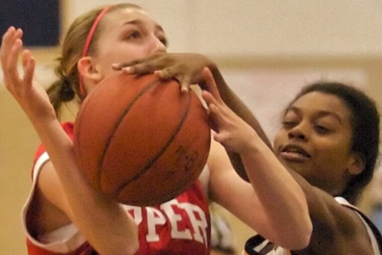 Upper Dublin's Kristen Fuery is fouled by Cheltenham's Monet Constant (right). Constant's 24 points led host Cheltenham past Suburban One American rival Upper Dublin, 64-42.