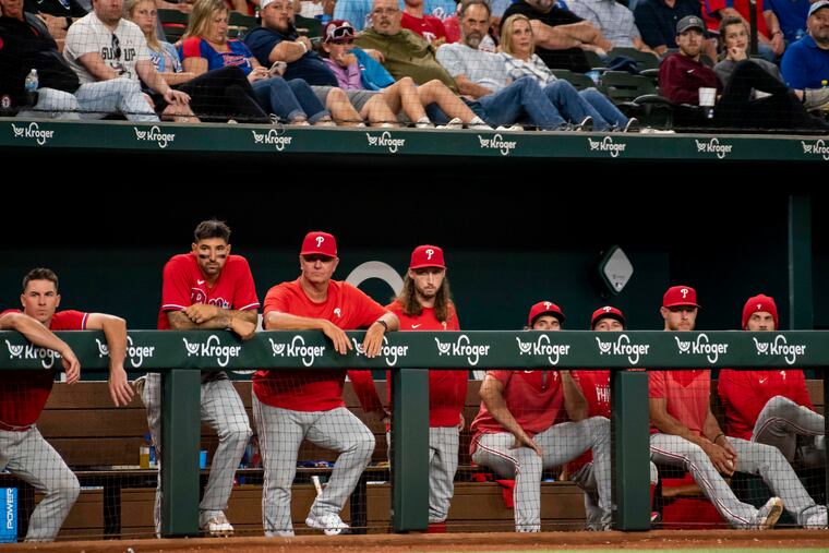 The Phillies look on in the ninth inning of their 2-1 loss to the Rangers on Sunday.