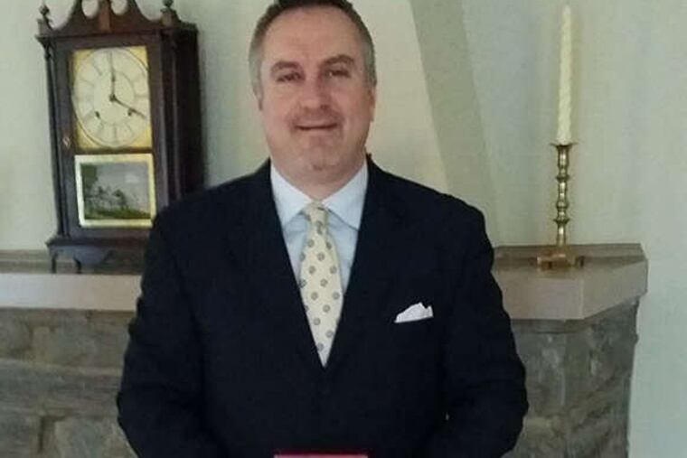 Joe Lombardo holds what he hopes are the remains of his beloved Samoyed, Butkus, but he has no proof the ashes are those of his dog.