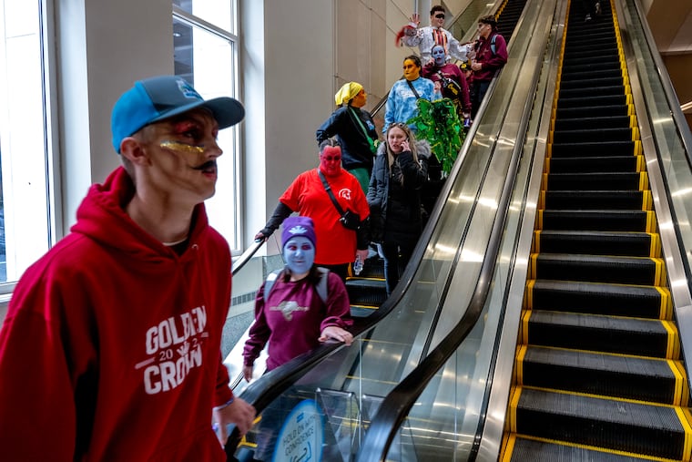 January 6, 2025: Performers — with facial makeup already applied — arrive at the Convention Center on New Year’s Day morning to get into costume for the Fancy Brigade finale.