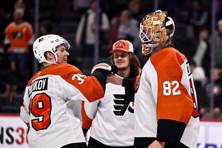 Matvei Michkov celebrates with goaltender Ivan Fedotov after the Flyers rookie scored in overtime to beat the Ottawa Senators.
